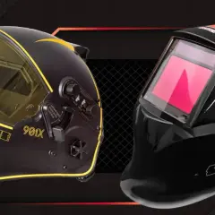 Dwie maski spawalnicze Spartus: czarna z żółtymi akcentami i żółtym wizjerem (model 901X) oraz czarna z czerwonymi liniami i czerwonym wizjerem (model 230XT). Pomoc w wyborze: jakie szkło do maski spawalniczej.