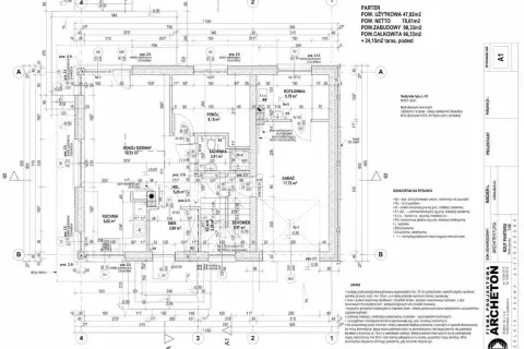 Rysunek techniczny przedstawia rzut parteru z wymiarami, oznaczeniami pomieszczeń (kuchnia, salon, garaż) i detalami konstrukcyjnymi.